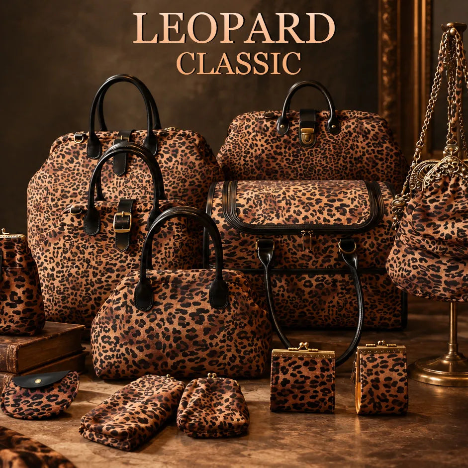 A coordinated set of leopard-print handbags, pouches, and small accessories arranged on a tabletop in a styled interior setting.