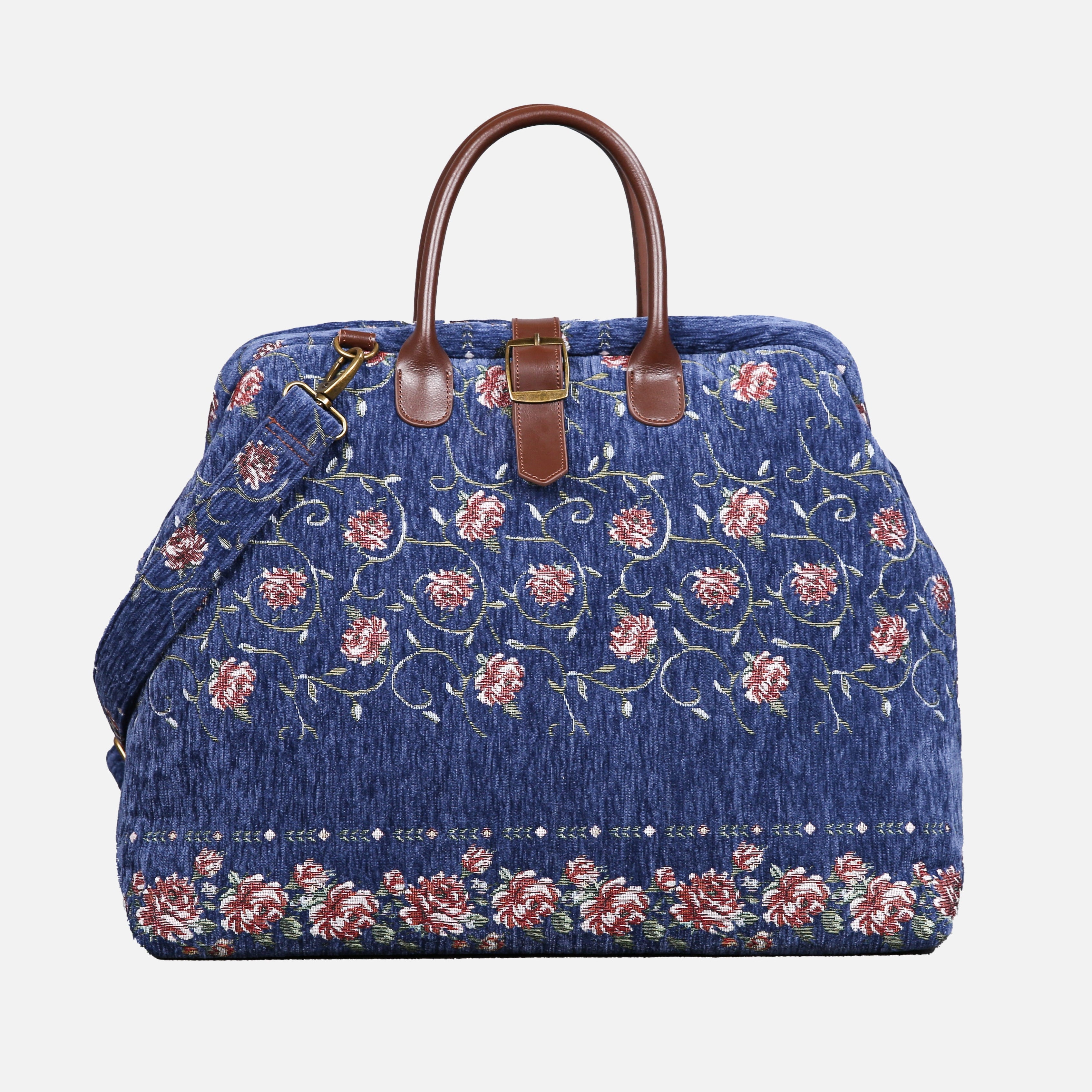 Blue floral-patterned bag with brown handles on a white background