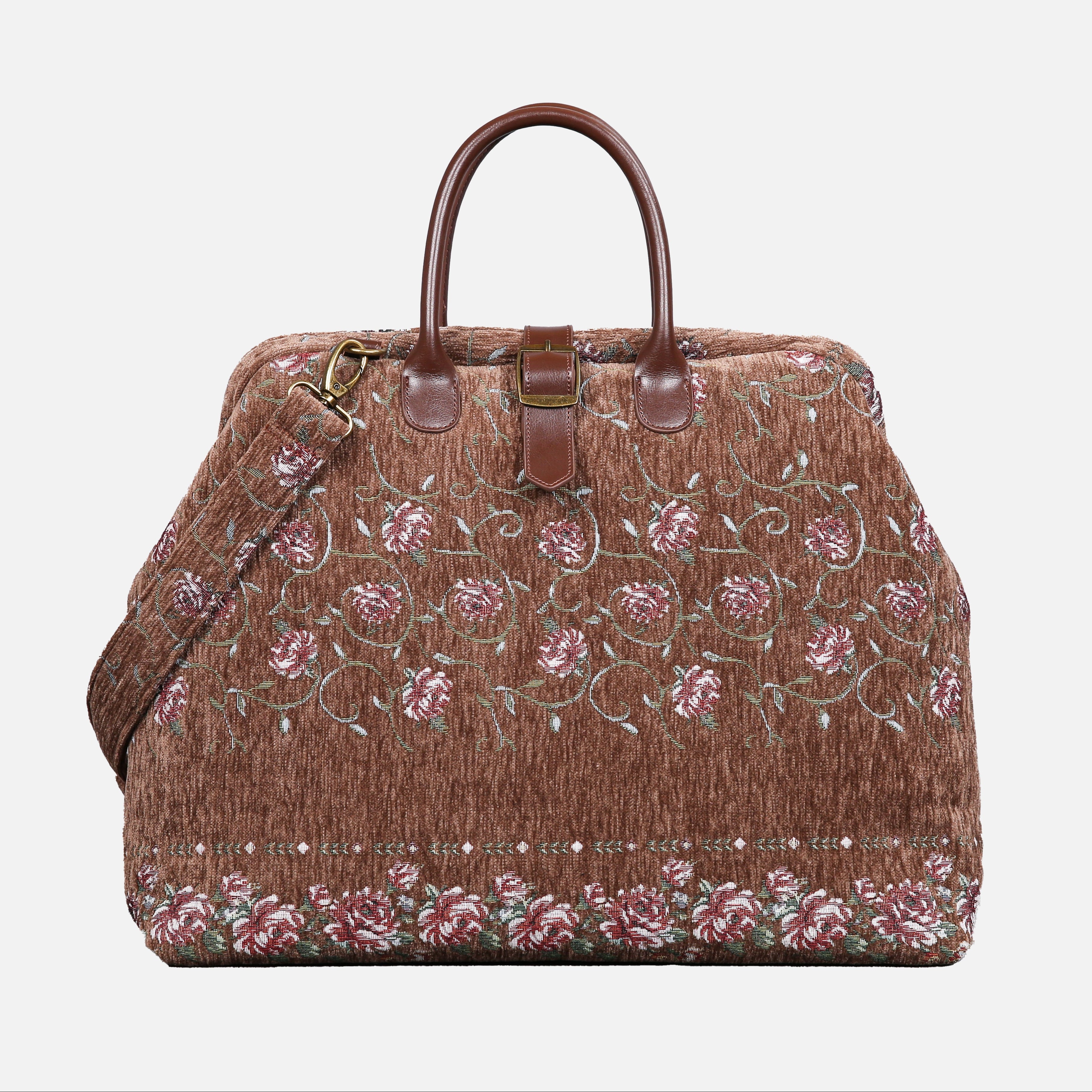 Brown floral embroidered bag with a strap on a white background