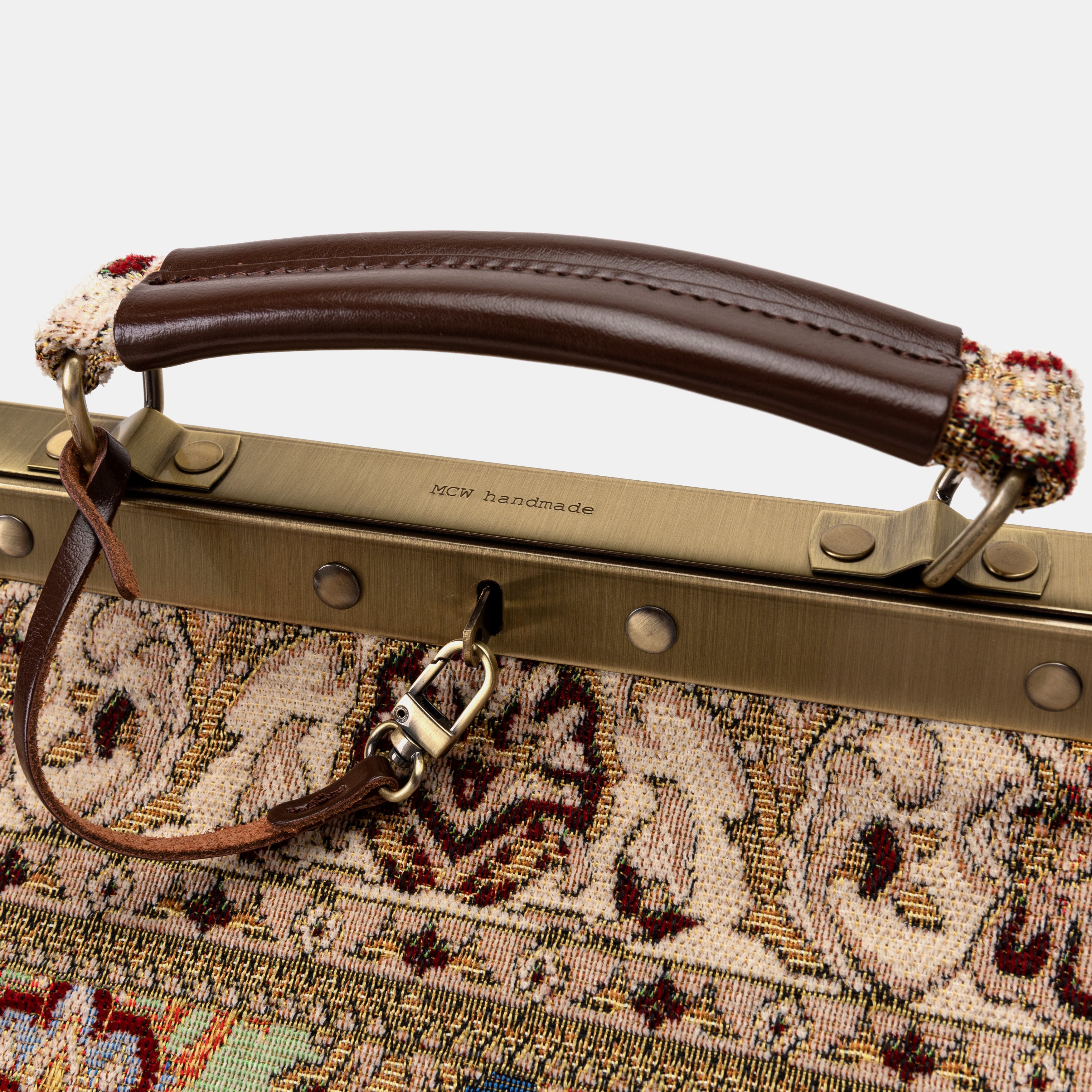 Golden Age Red Genevieve Carpet Gladstone Bag of America logo