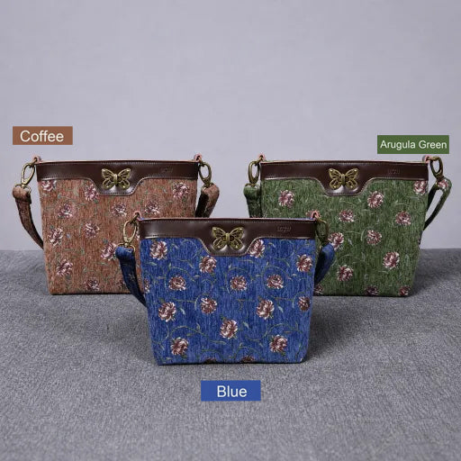 Three butterfly satchel bags in Coffee, Blue, and Arugula Green with floral patterns on a gray background.