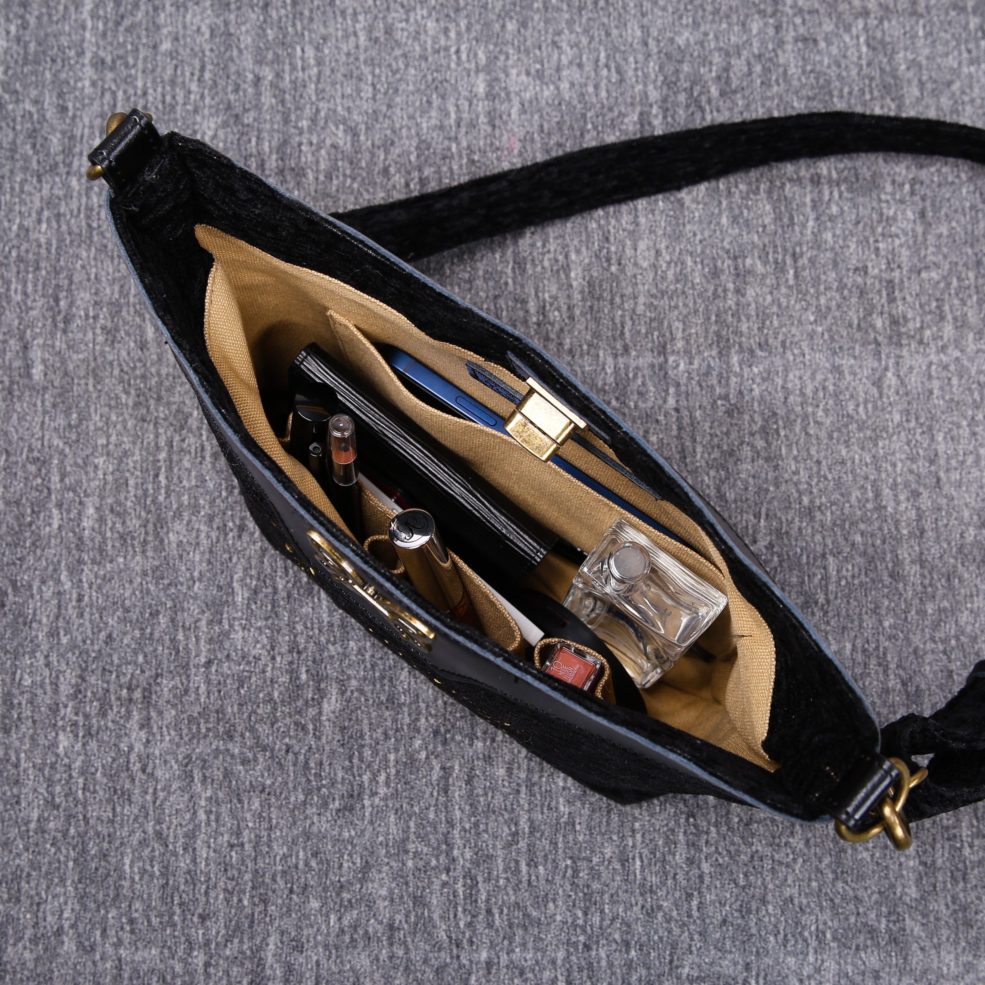 Luxury Monogrammed Black Butterfly Crossbody Bag (Logo) of America in use