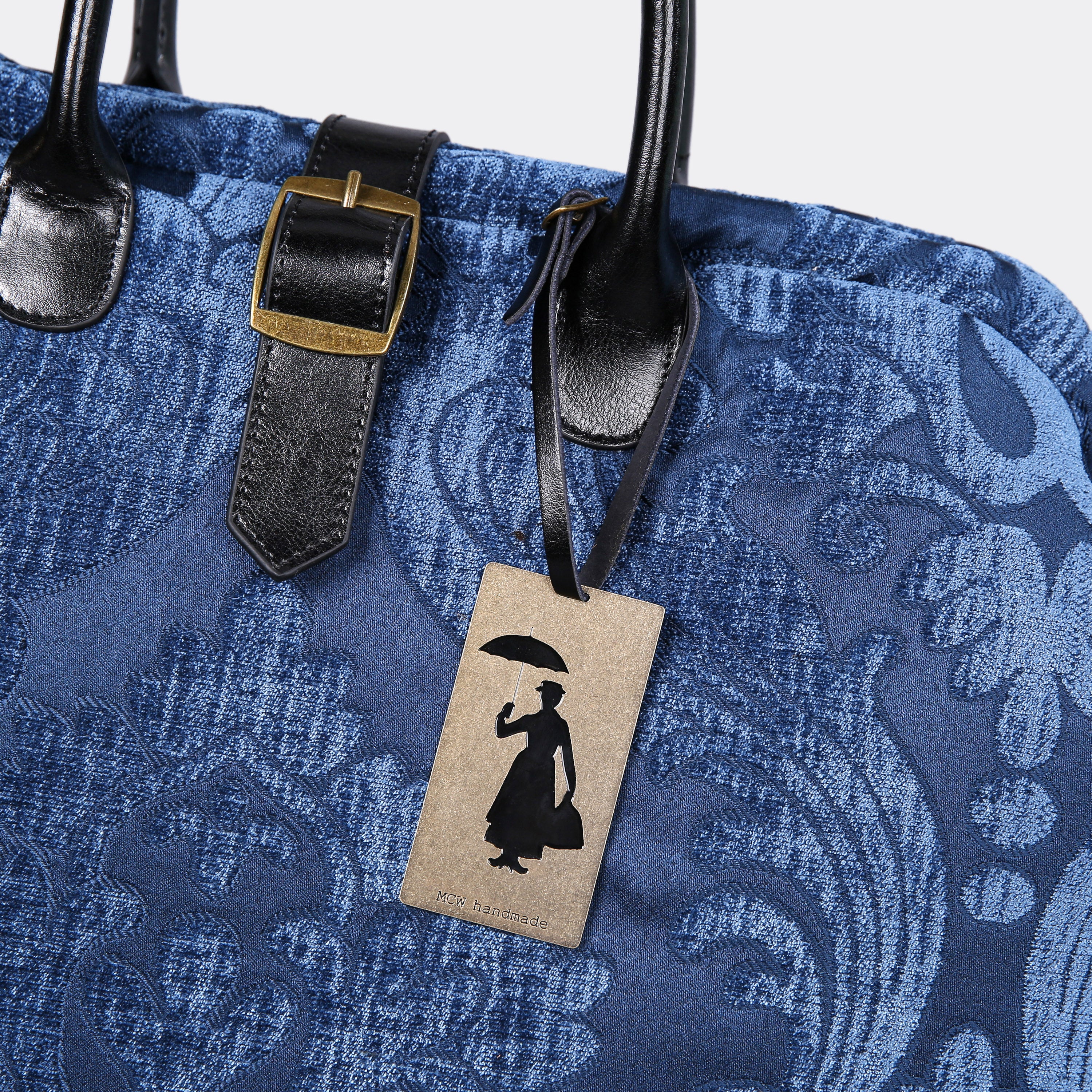 Mary Poppins Brass Measuring Tape Luggage Tag of America in use