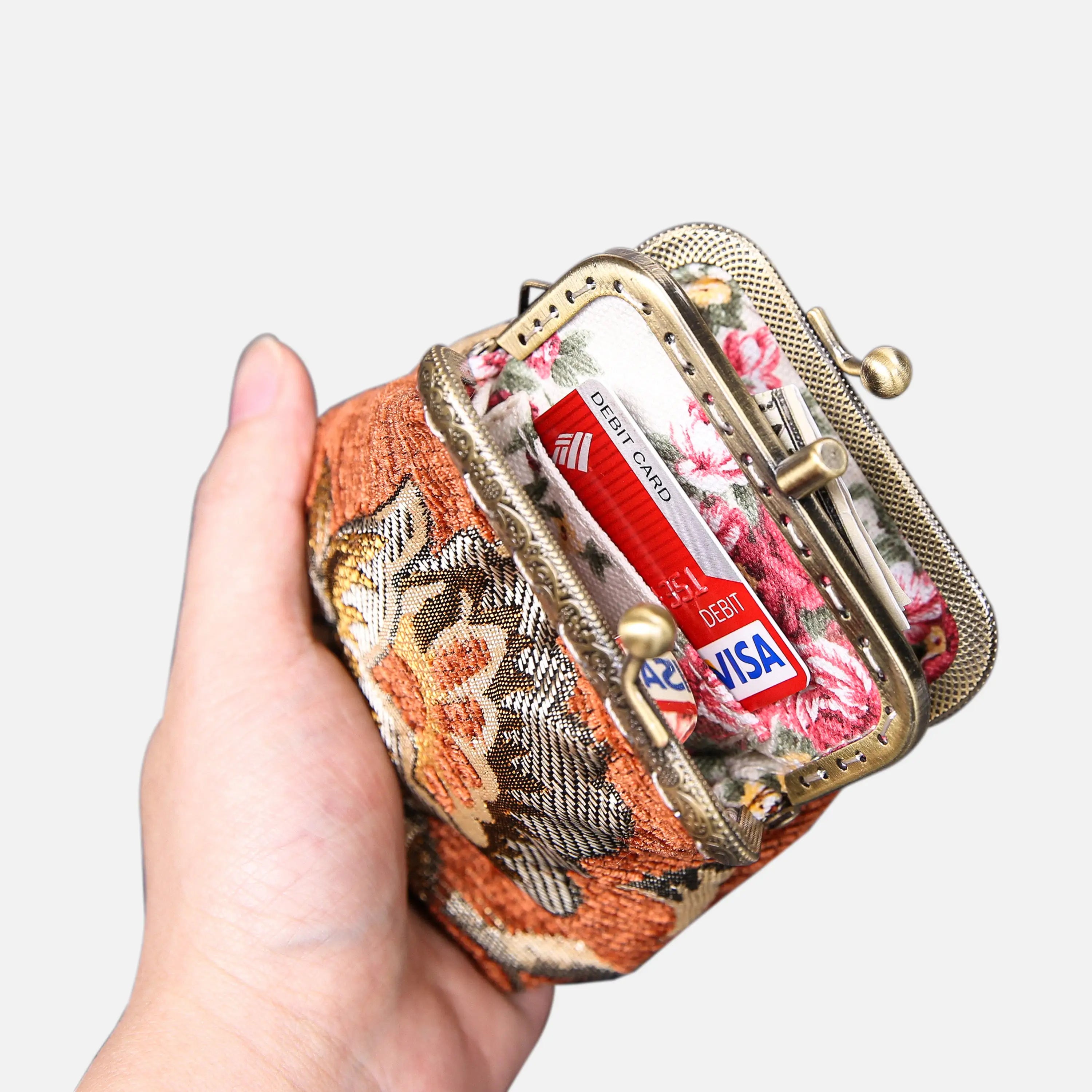 Paisley Orange Double Kiss Clasp Coin Purse of America holding