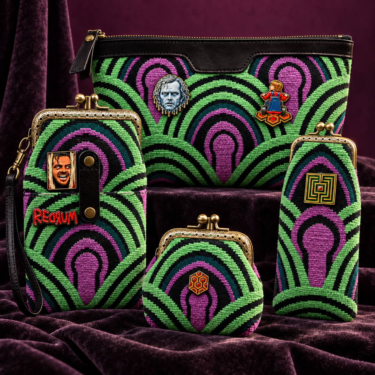 A coordinated set of carpetbags from MCW CARPETBAGS clutch, pouch, and coin purse accessories arranged together on a purple velvet surface. The items feature a bold psychedelic keyhole pattern in bright green, magenta, and black, with gold-tone metal kiss-lock closures and embroidered character face patches including Enamels pins.