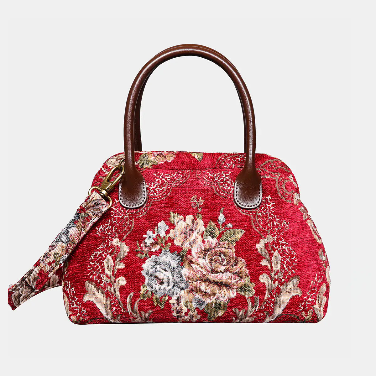 Red floral patterned handbag with brown handle on a light gray background