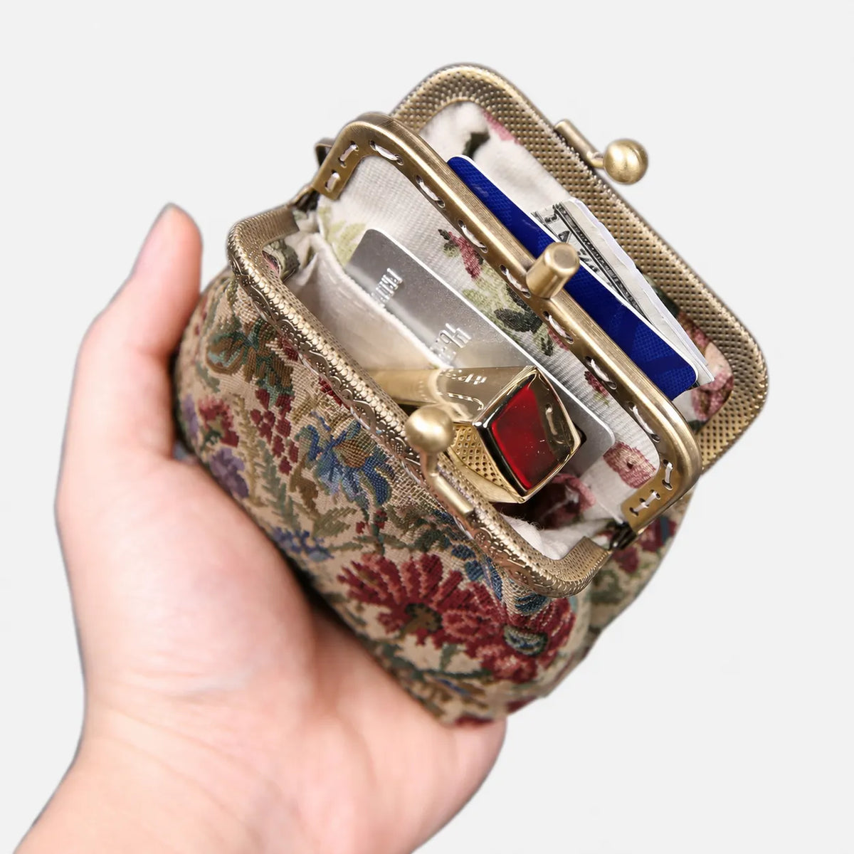 Spring Valley Double Kiss Clasp Coin Purse of America holding