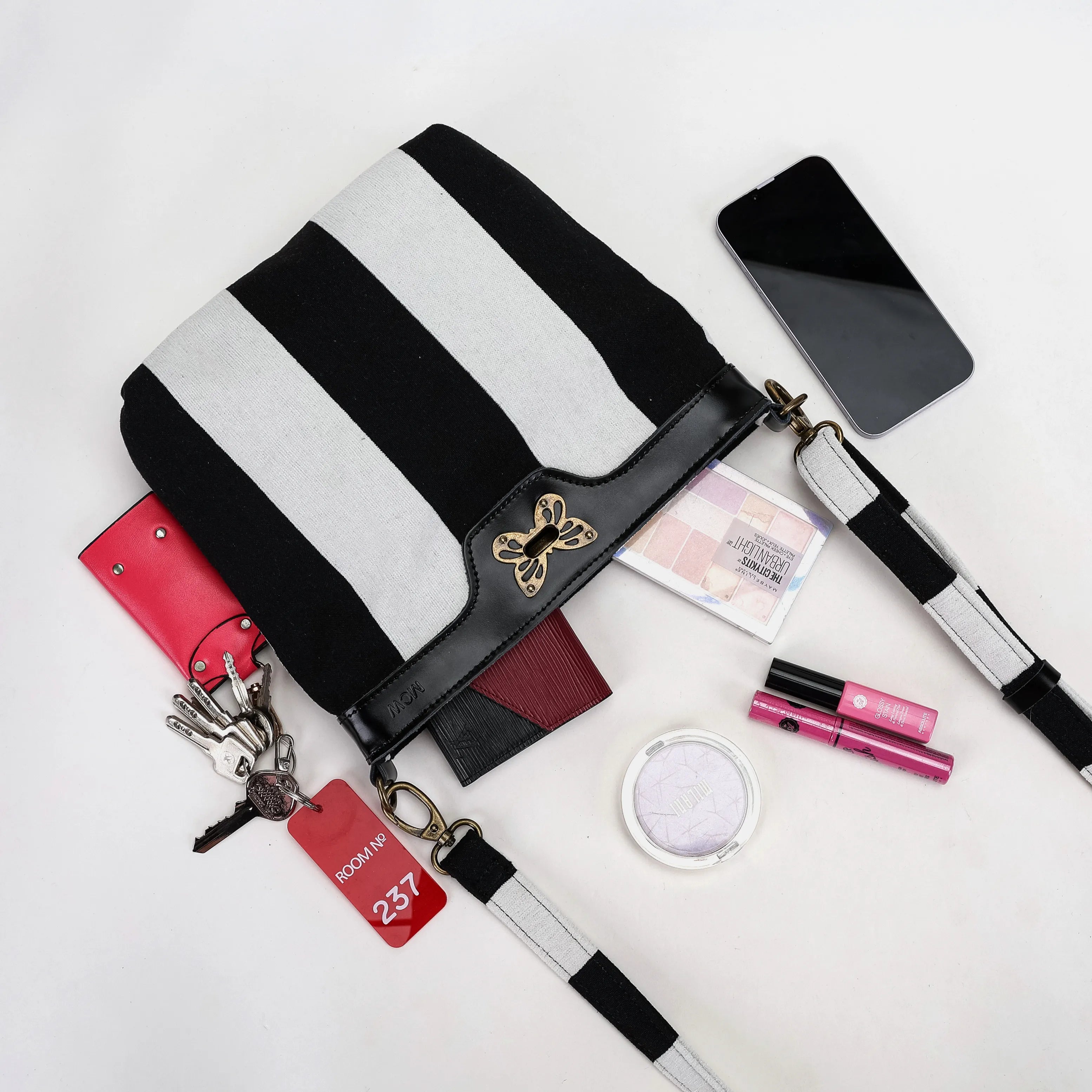 Black & White Beetlejuice Crossbody Carpet Bag lying down